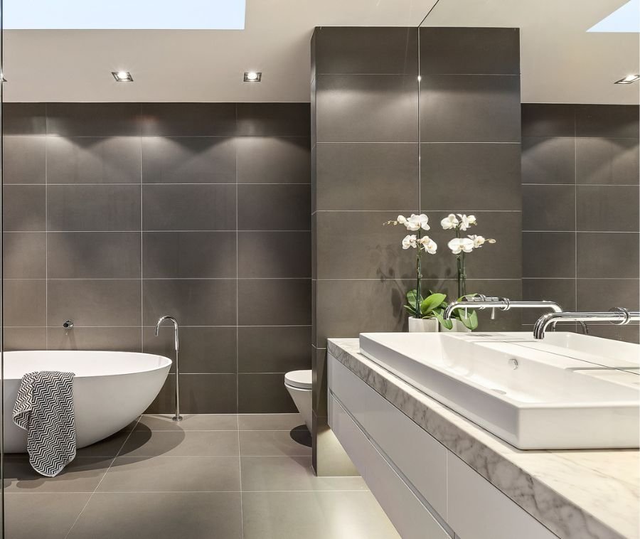 Bathroom restoration with bright tiles and restored fixtures